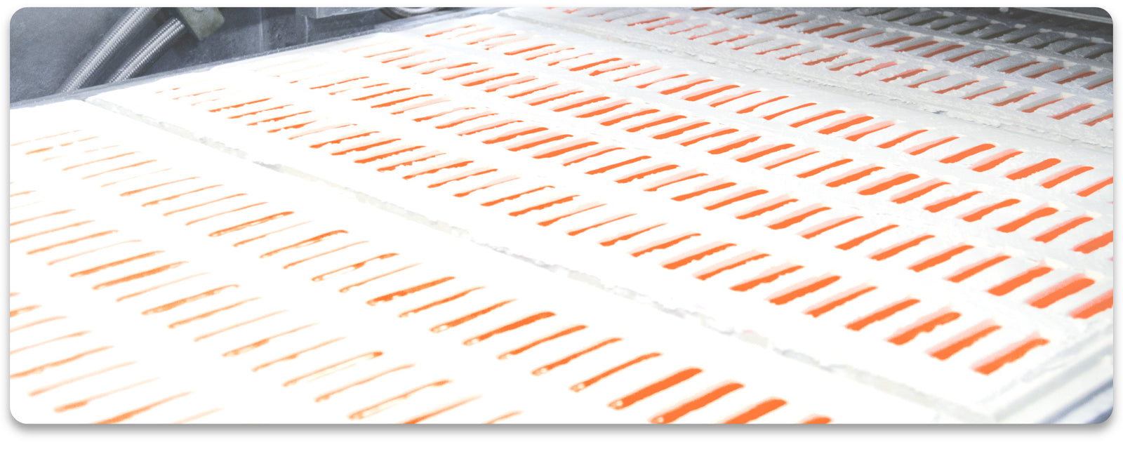 Starch Trays with Orange Sticks being made - Contract Manufacturing by Sweet Candy Company